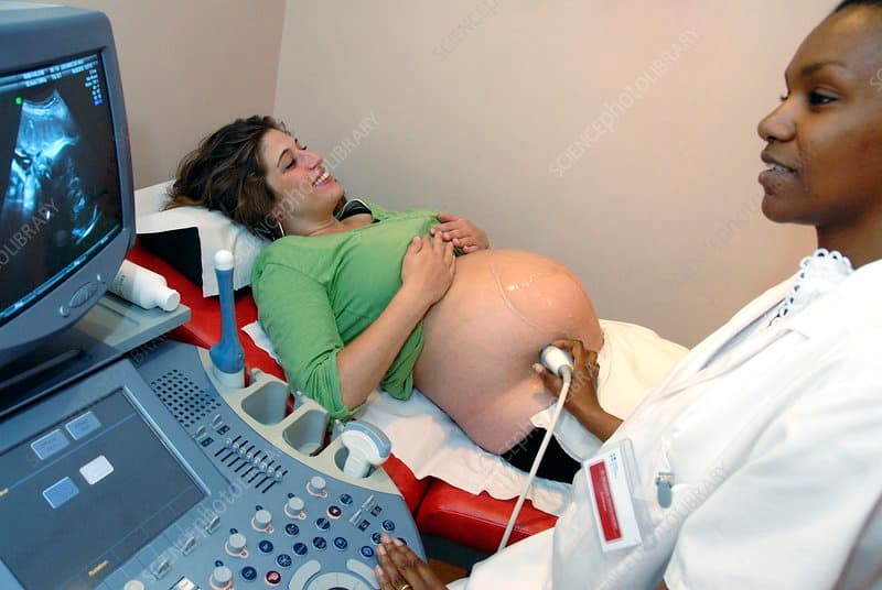 Technician performing an ultrasound scan